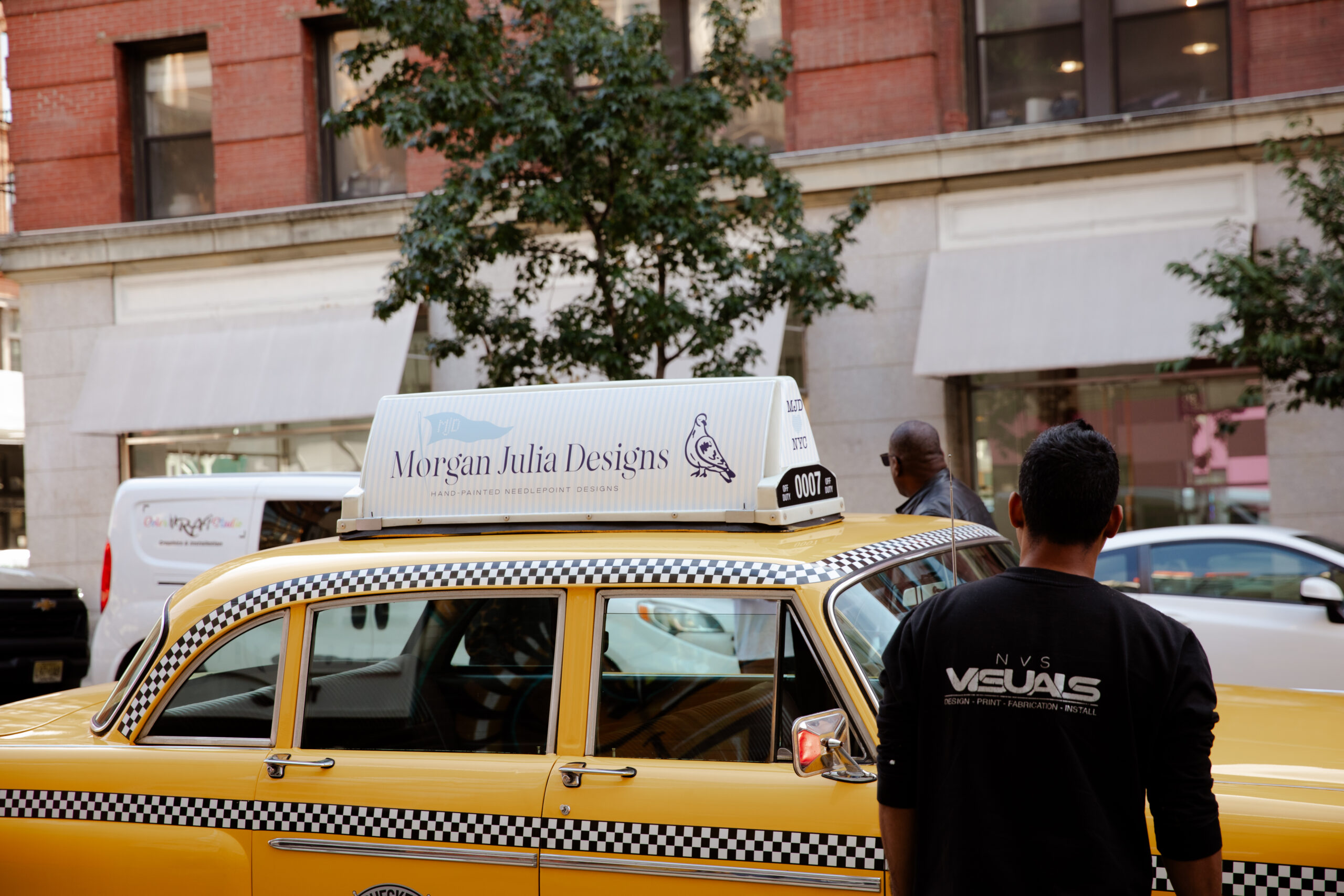 Classic New York Checkered Cab converted into a branded experiential vehicle for retail and photo activations, wrapped and detailed in-house.