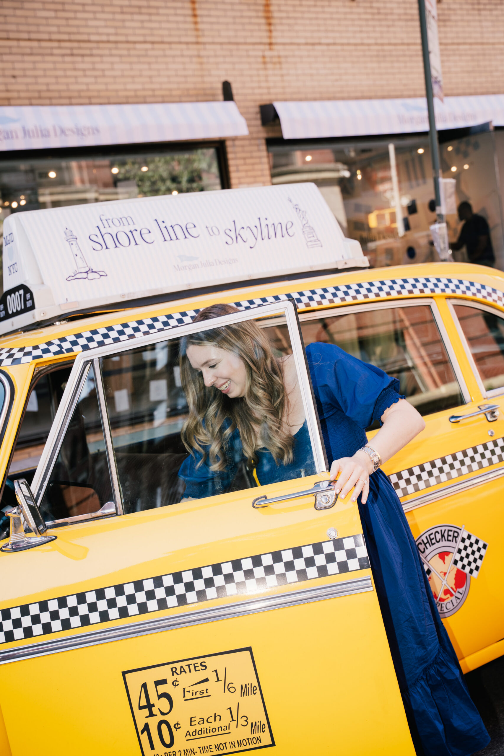 Classic New York Checkered Cab converted into a branded experiential vehicle for retail and photo activations, wrapped and detailed in-house.