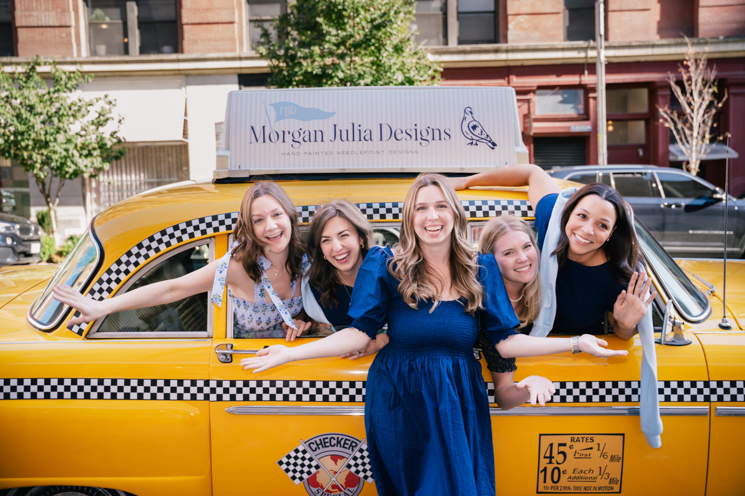 Classic New York Checkered Cab converted into a branded experiential vehicle for retail and photo activations, wrapped and detailed in-house.