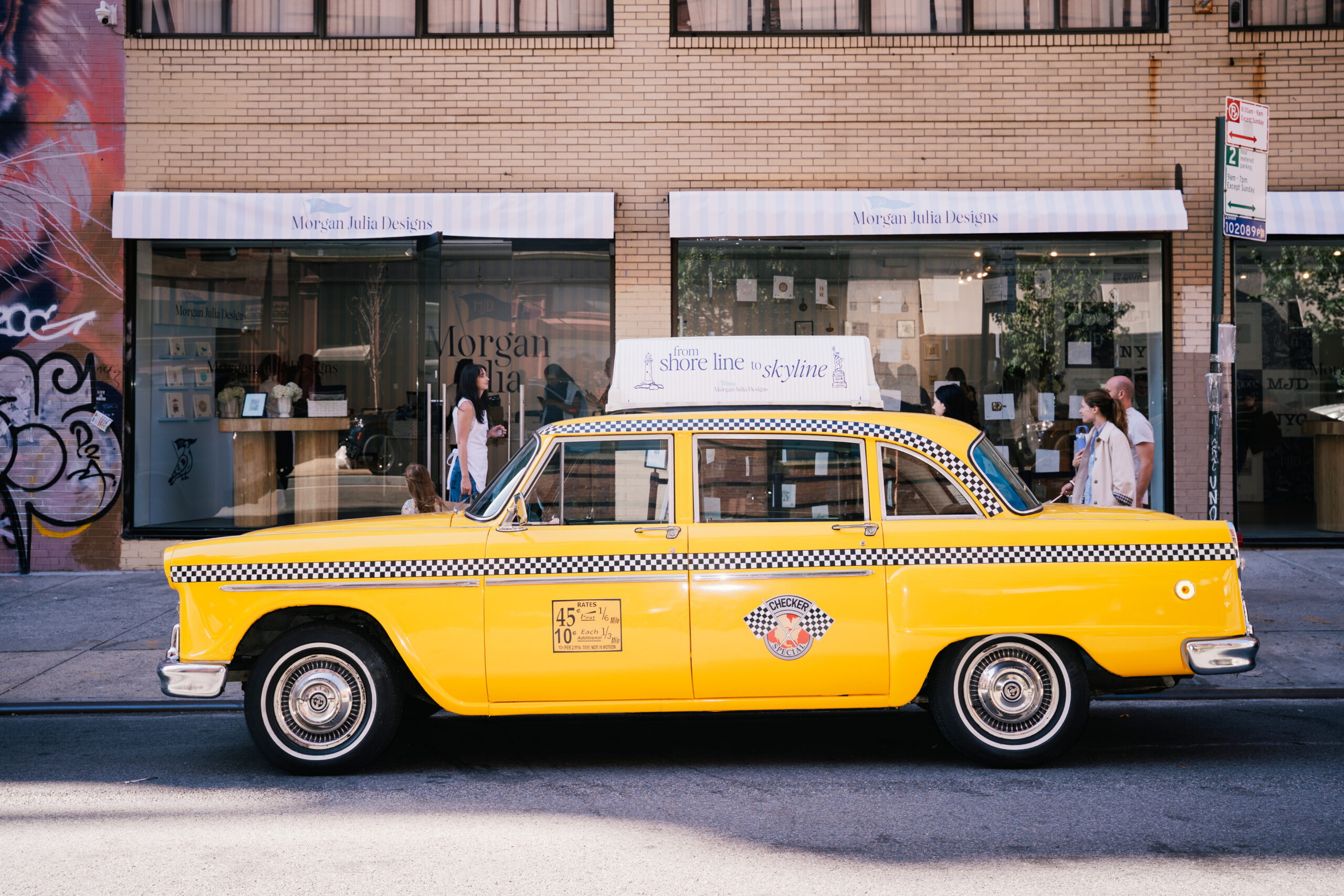 Classic New York Checkered Cab converted into a branded experiential vehicle for retail and photo activations, wrapped and detailed in-house.