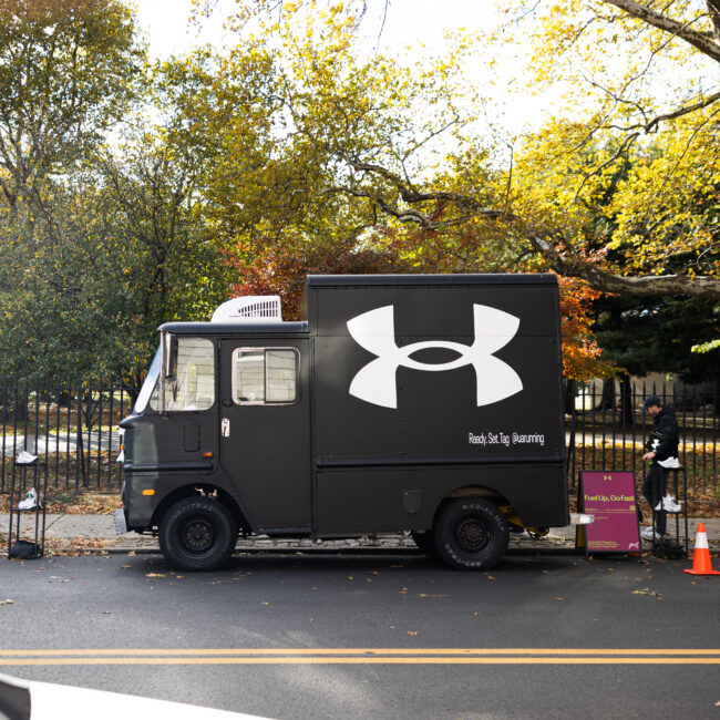 Branded coffee truck activation for Under Armour during the NYC Marathon featuring matte black wrap, signage, and in-house fabrication by NVS Visuals.