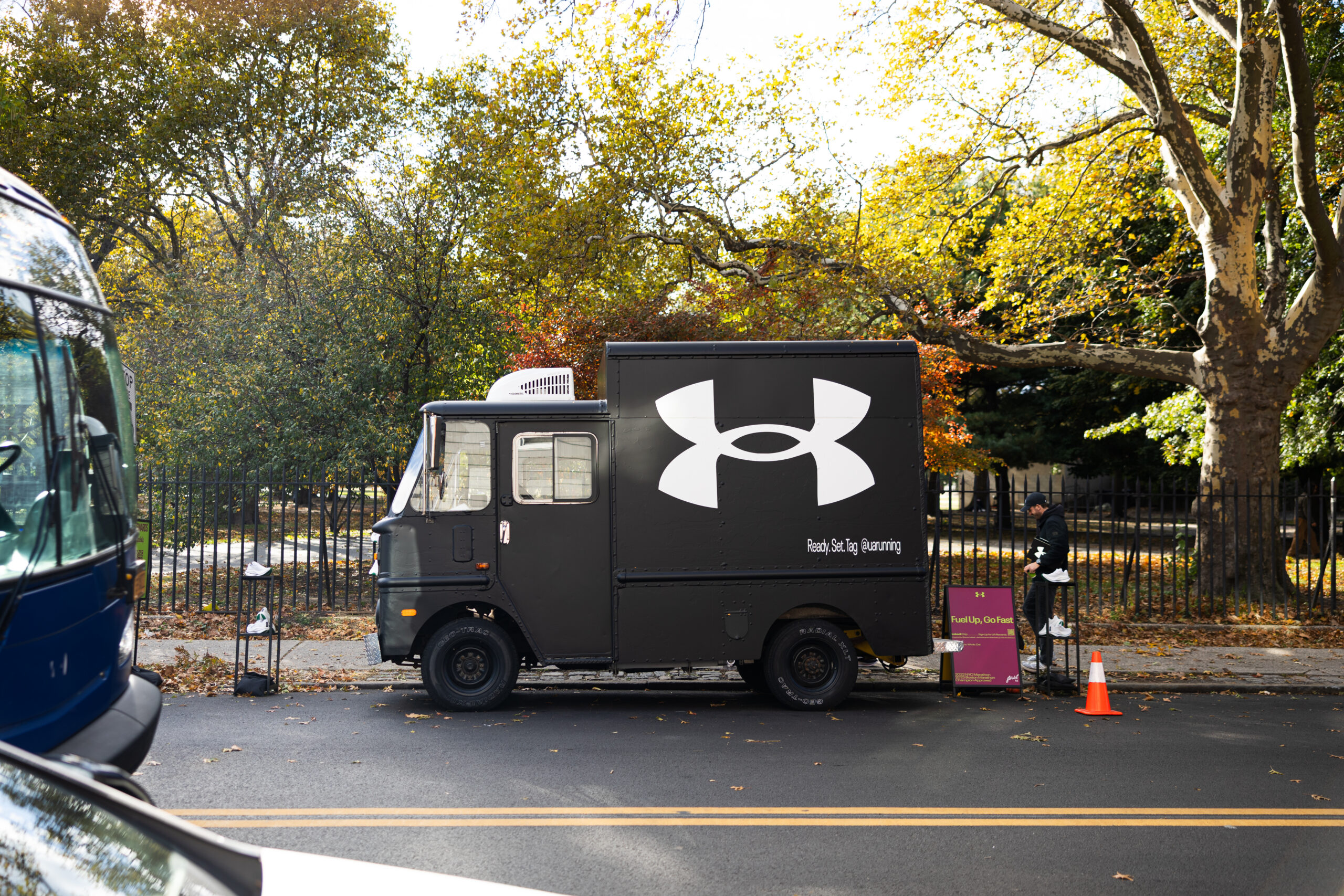 Branded coffee truck activation for Under Armour during the NYC Marathon featuring matte black wrap, signage, and in-house fabrication by NVS Visuals.