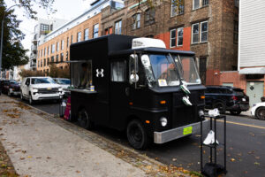 coffe-pop-up-ice-cream-nyc-7 Branded coffee truck activation for Under Armour during the NYC Marathon featuring matte black wrap, signage, and in-house fabrication by NVS Visuals.