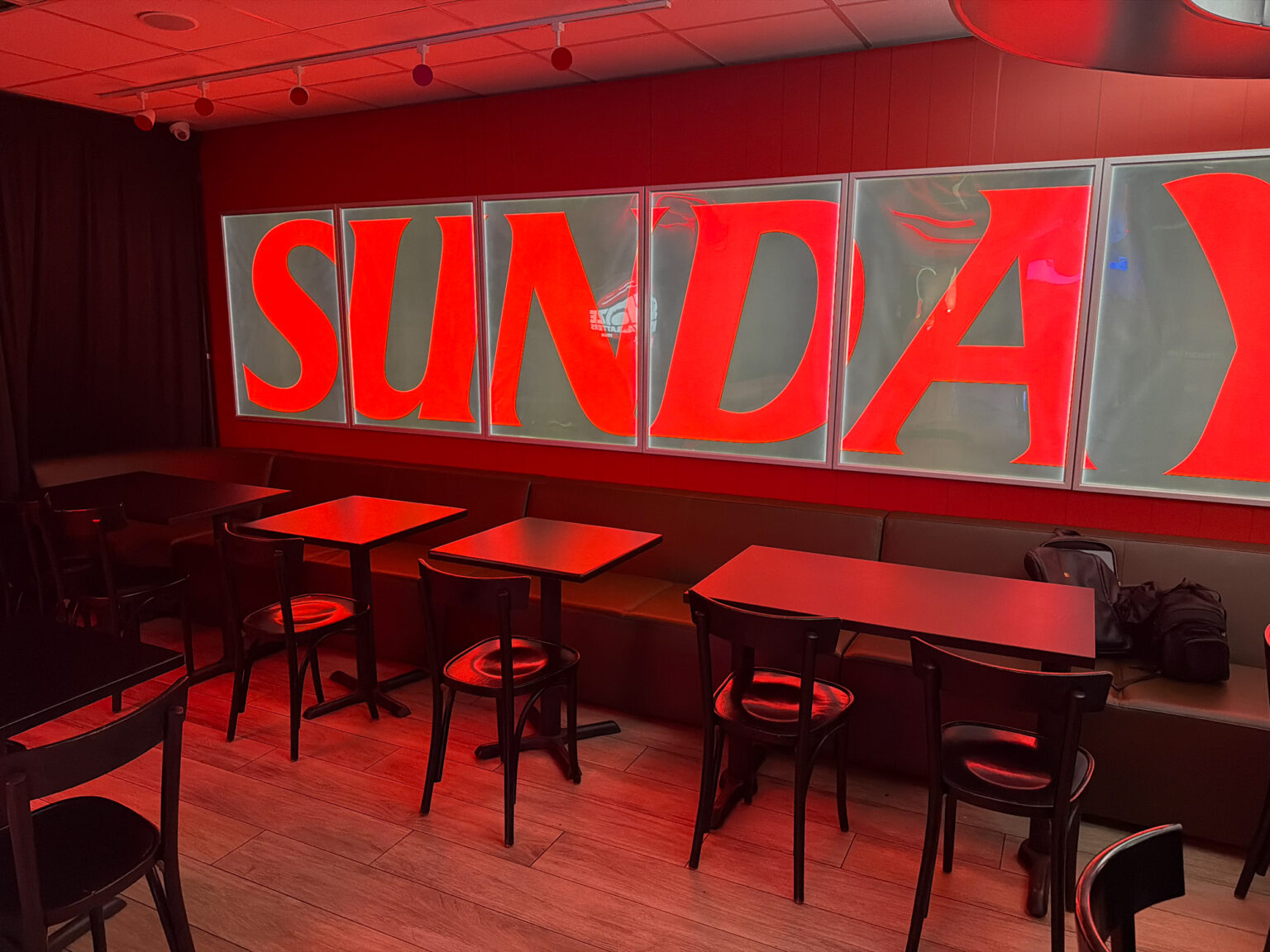 kfc-sundays-pop-up-nyc-brand-takeover-activation-19 Interior brand takeover pop up with custom grasscloth wallpaper, LED frames, and scenic flats fabricated by NVS Visuals. fabrication, video wall, light boxes and vinyl