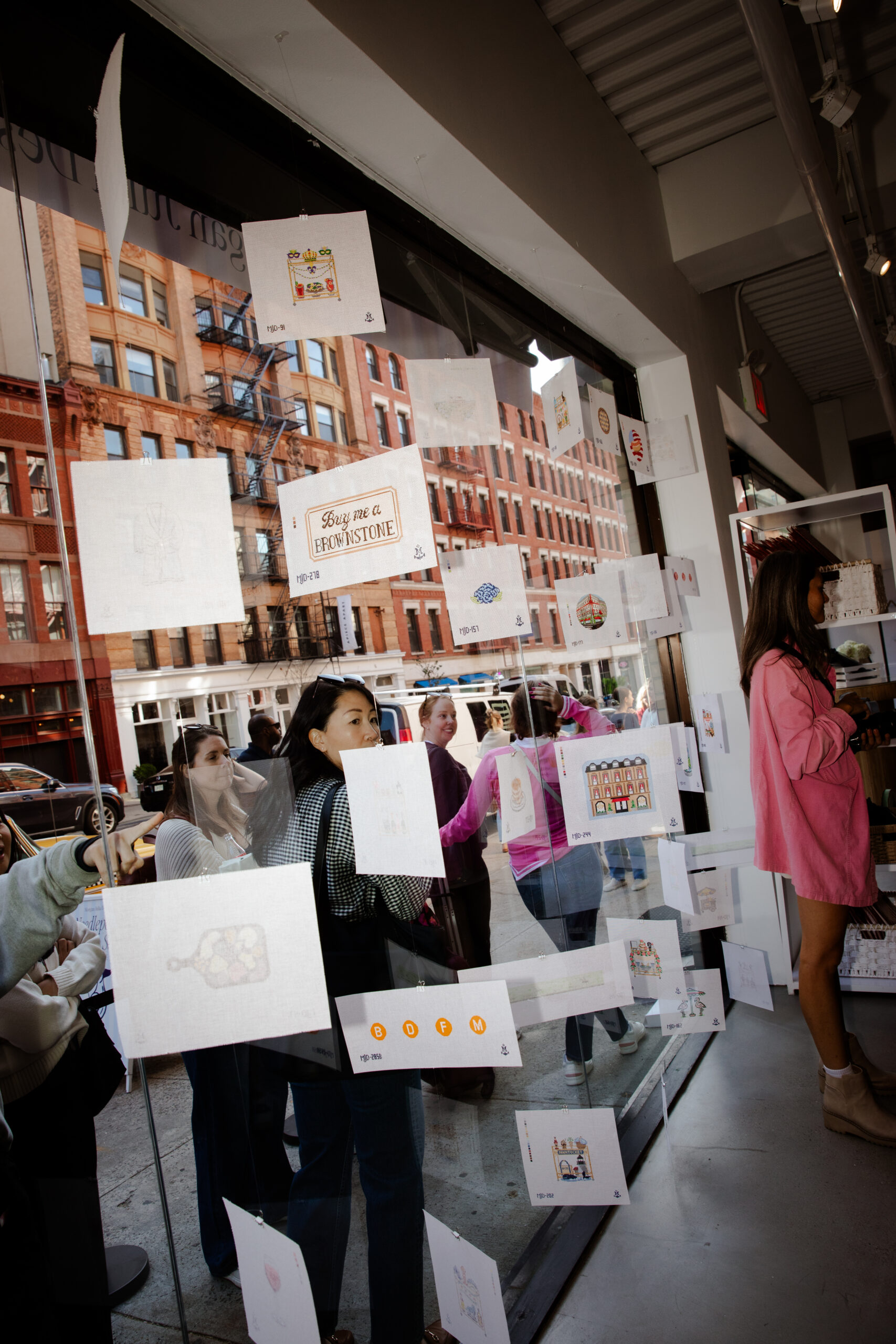 Newspaper-inspired pop-up for Morgan Julia Design featuring custom fabrication, vinyl wraps, and branded checkered cab photo moment by NVS Visuals.