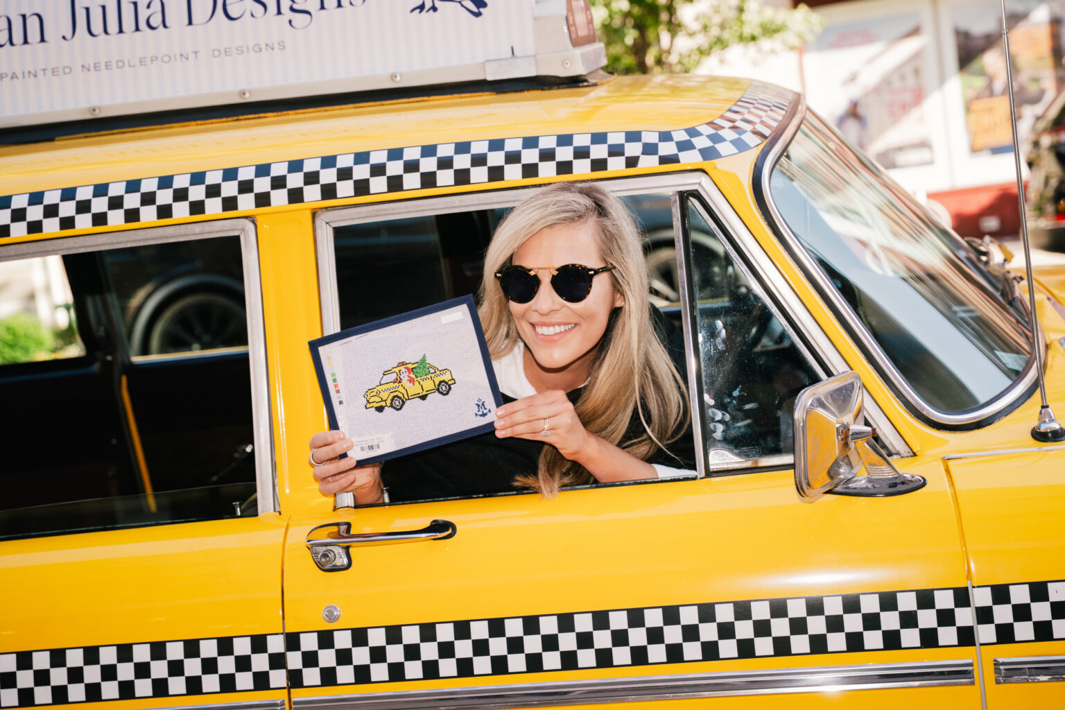 Morgan Julia Pop Up Fabrication Visuals Event Newspaper-inspired pop-up for Morgan Julia Design featuring custom fabrication, vinyl wraps, and branded checkered cab photo moment by NVS Visuals.
