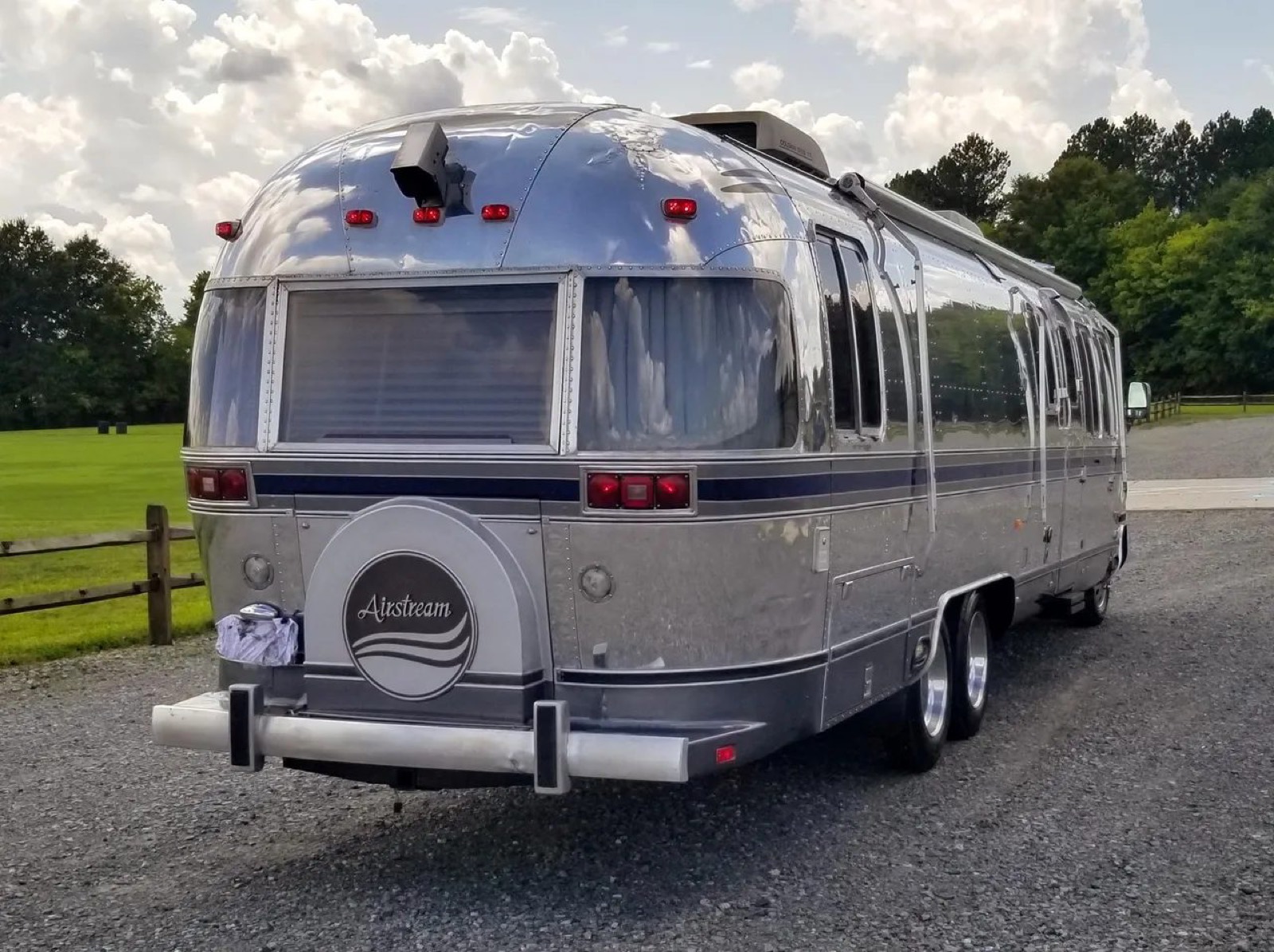 1984 Airstream RV — rear, pre-branding Polished 1984 Airstream RV rear three-quarter view, unbranded