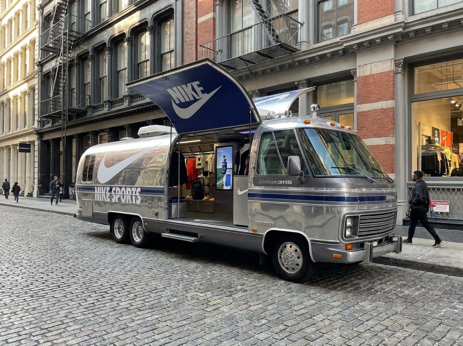 1984 Airstream RV — sports retail concept Concept render of Airstream RV wrapped as a sports retail pop-up in SoHo with branded awning
