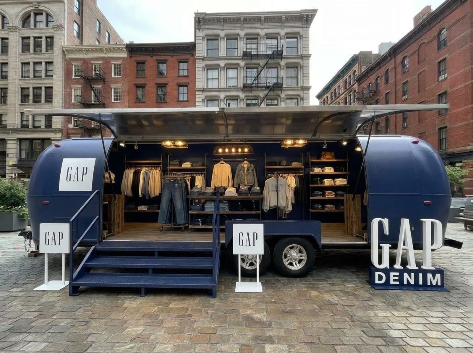 31' Gullwing Airstream — denim pop-up concept Concept render of Gullwing Airstream as a denim retail pop-up with navy exterior