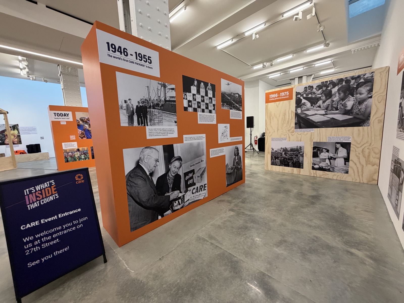 care-org-branded-environment-interior-exhibition Care.org 'It's What's Inside That Counts' interior exhibition — orange branded timeline walls and scenic panels