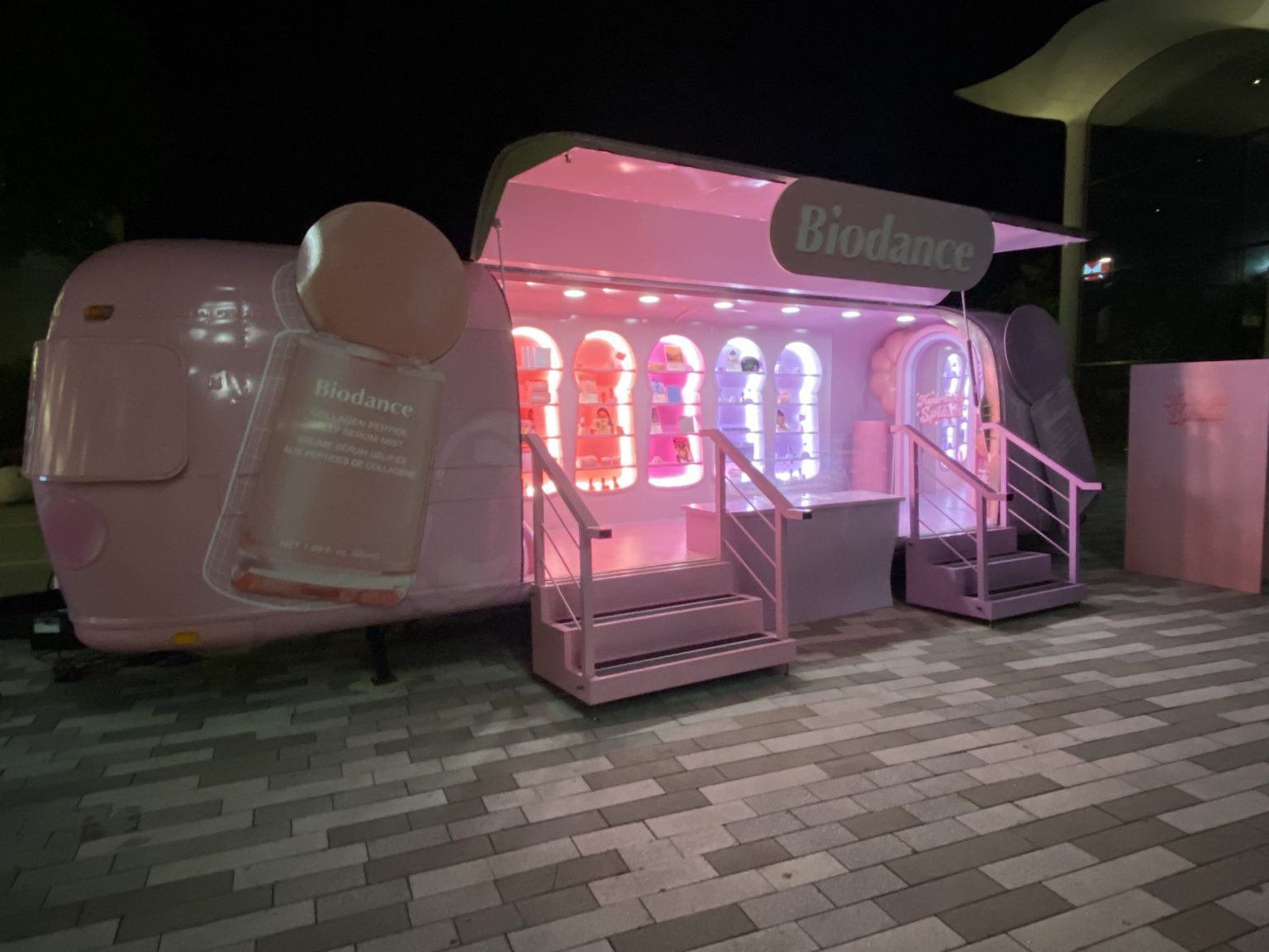 m01 Biodance gullwing Airstream lit at night at Aventura Mall, Miami