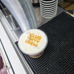 Belvedere Dirty Brew cocktail with flavored foam and printed Club Dirty Brew logo