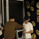 NVS crew installing the walk-in photo booth