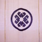 Tatcha crest on double-sided architectural film plexiglass wall, Grand Central pop-up by NVS Visuals