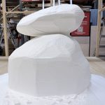 CNC hot-wire cut foam stacked-stone speaker enclosures before sculpting and paint, NVS Visuals shop