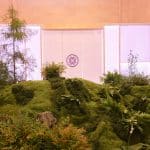 CNC hot-wire cut and sculpted foam moss hillside in front of the Tatcha tea pavilion