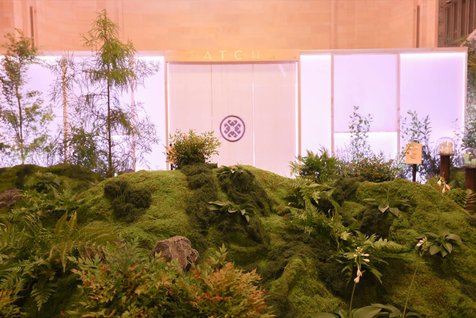 CNC hot-wire cut and sculpted foam moss hillside in front of the Tatcha tea pavilion CNC hot-wire cut and sculpted foam moss hillside in front of the Tatcha tea pavilion