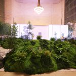 Moss mounds and sculpted stacked-stone speaker cover fabricated by NVS Visuals for Tatcha