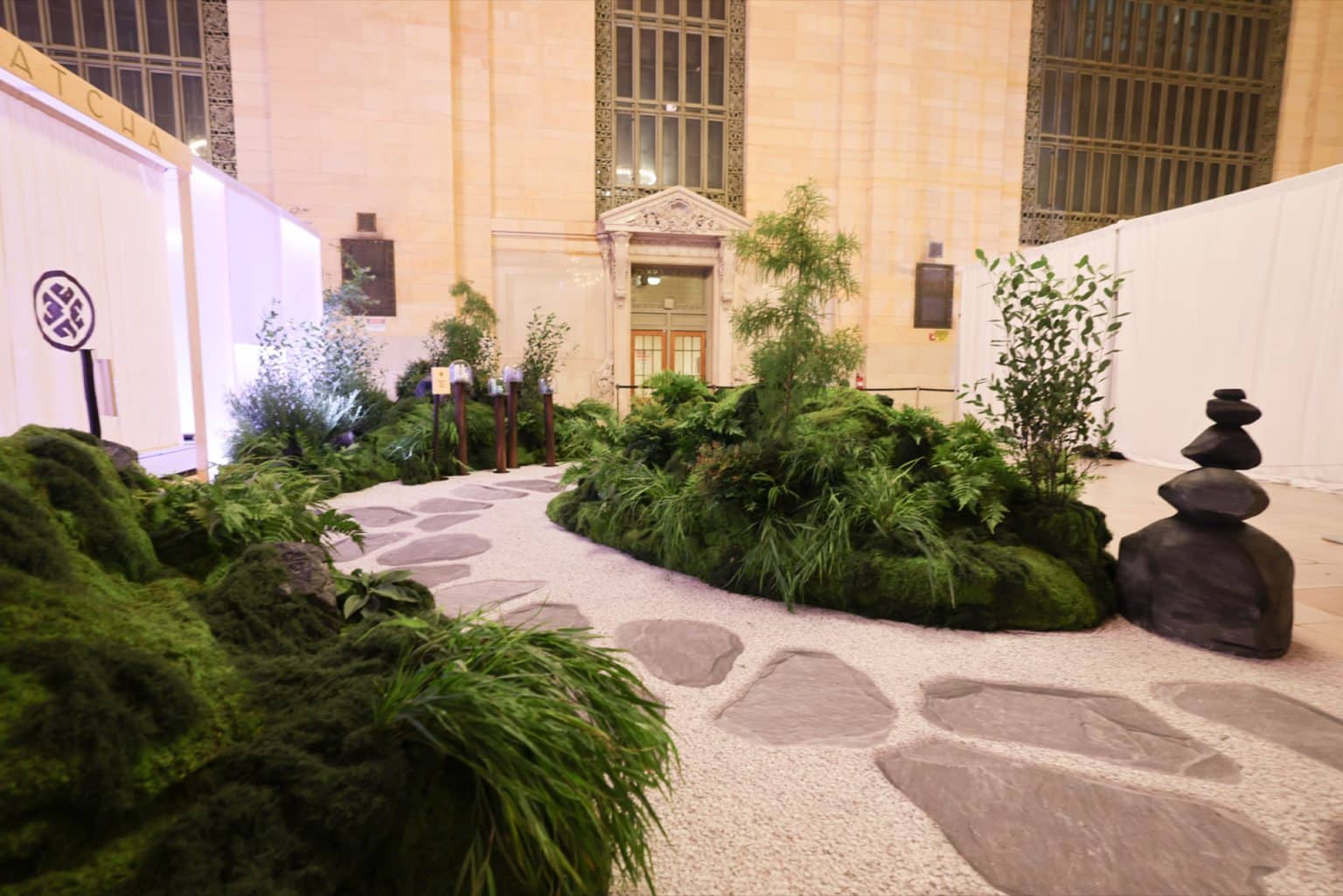 Printed roji stepping-stone pathway and stacked-stone speaker enclosure, Tatcha Grand Central Printed roji stepping-stone pathway and stacked-stone speaker enclosure, Tatcha Grand Central