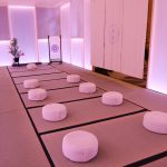 Tatcha tea room interior with floor cushions inside the plexiglass pavilion