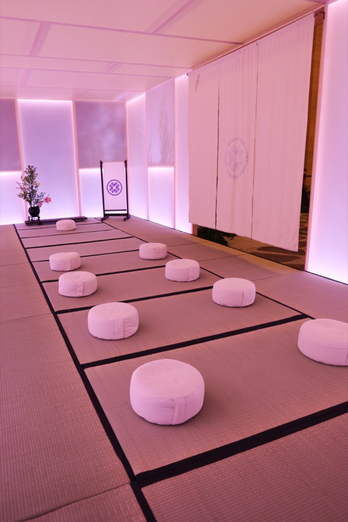 Tatcha tea room interior with floor cushions inside the plexiglass pavilion Tatcha tea room interior with floor cushions inside the plexiglass pavilion