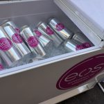 Branded eos water cans chilled in the cooler