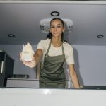 Server handing out Farmacy froyo from the truck serving window