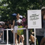 Guests lined up at the Farmacy x Sephora pop-up sign