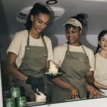 Servers smiling in the Farmacy truck window