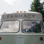 Front of the vintage step truck lettered FARMACY