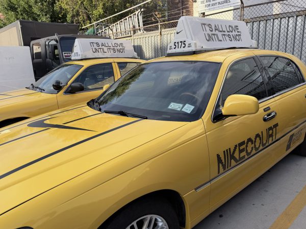 Two NikeCourt branded yellow cabs Two NikeCourt-branded vintage NYC yellow cabs with custom roof toppers