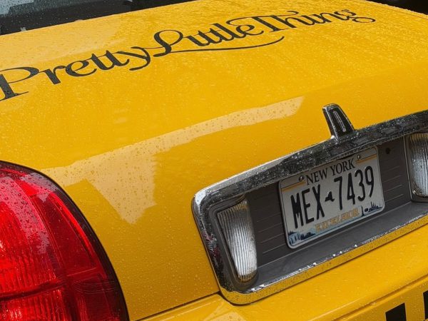 PrettyLittleThing branded yellow cab PrettyLittleThing script logo on the trunk of a vintage NYC yellow cab